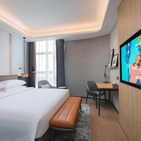 Park Inn By Radisson Nanchong Yilong Star City Plaza Экстерьер фото